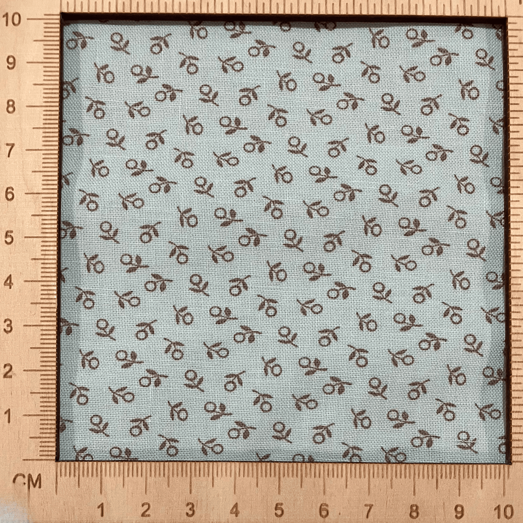 4"x4" scale — 100% cotton quilting fabric — tiny sage green flowers on mint. 44/45in width.