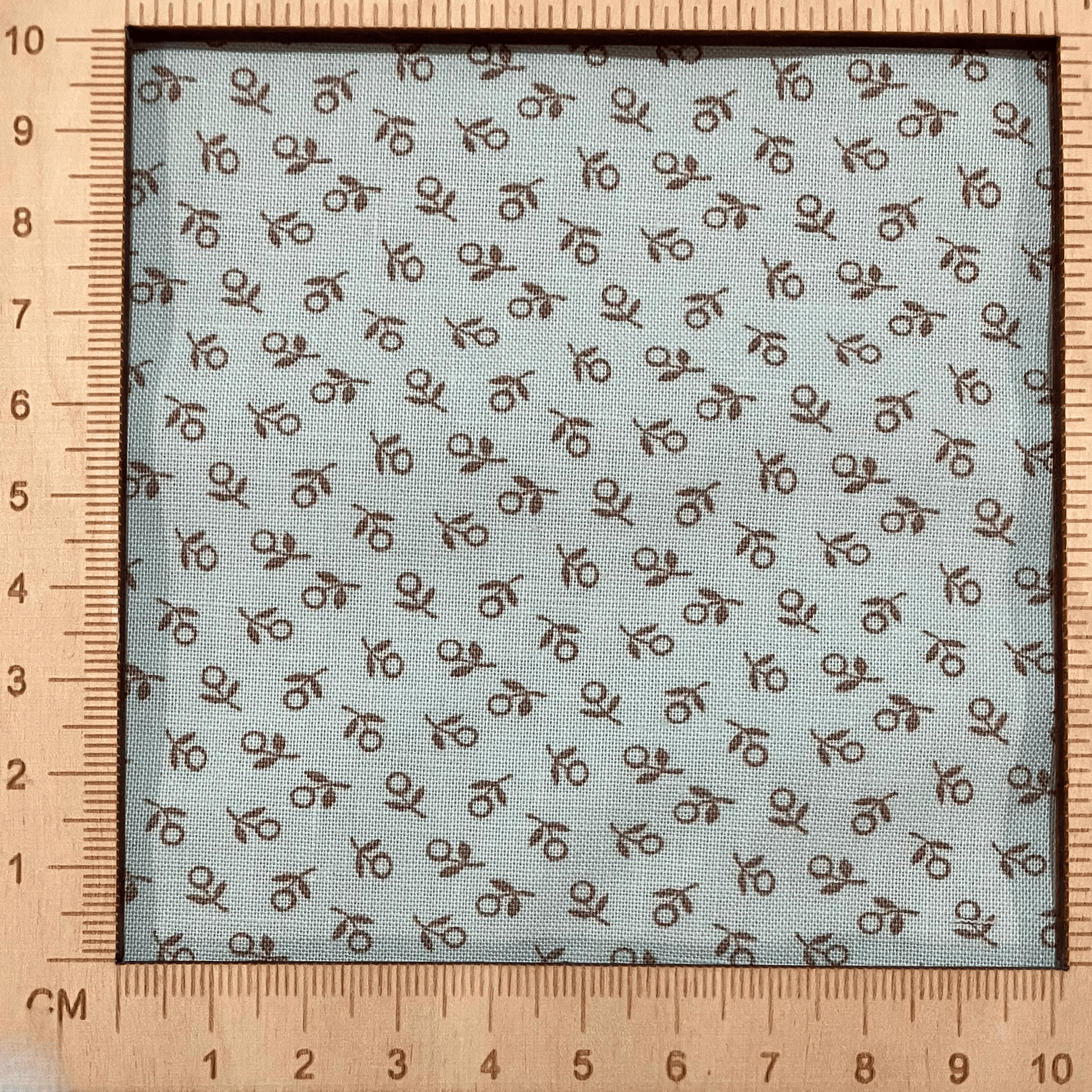 4"x4" scale — 100% cotton quilting fabric — tiny sage green flowers on mint. 44/45in width.