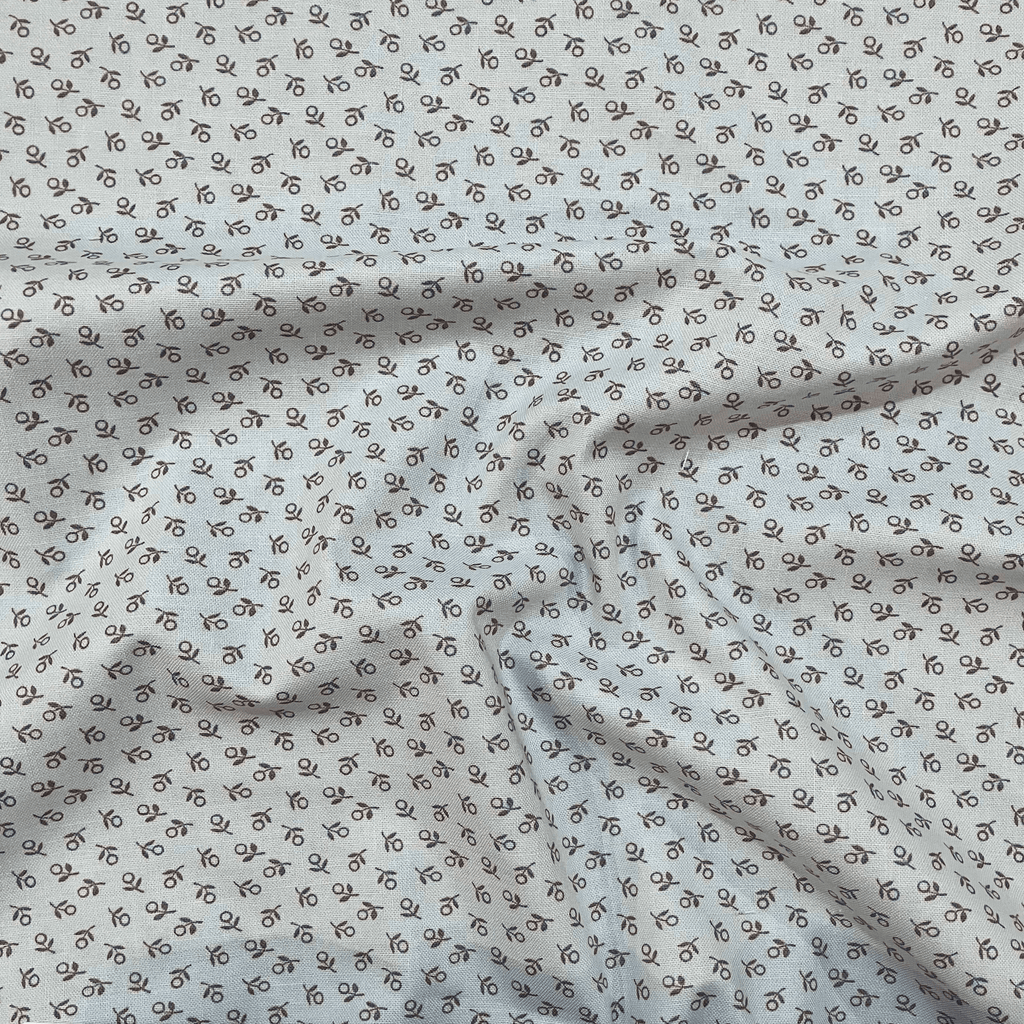 100% cotton quilting fabric — tiny sage green flowers on mint. 44/45in width.