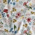 100% cotton quilting fabric — multicoloured labelled flowers on white. 43/44in width.