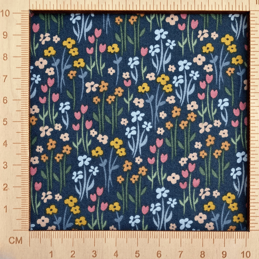 4"x4" scale — 100% cotton quilting fabric — multicoloured flowers with stems on dark green-grey. 43/44in width.