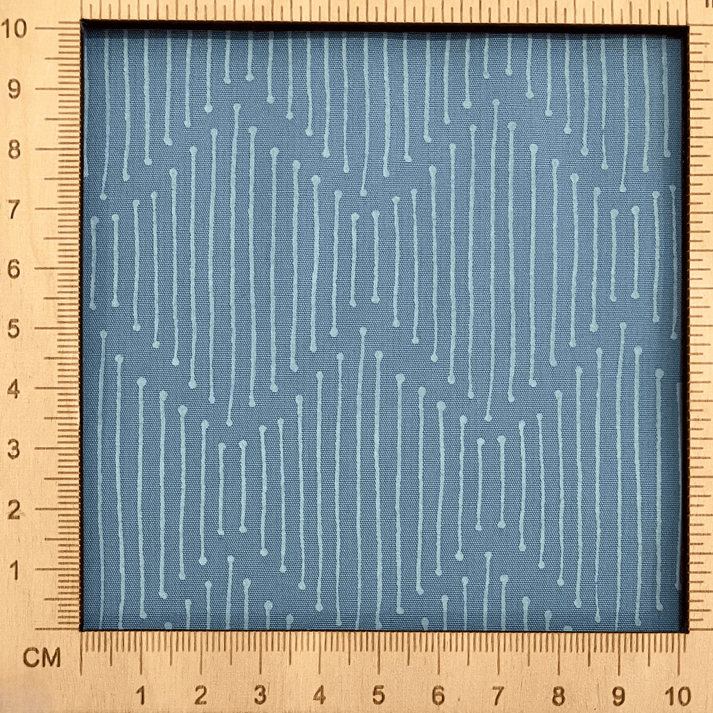 4"x4" scale — 100% cotton quilting fabric — broken white lines on soft grey-blue. 43/44in width.