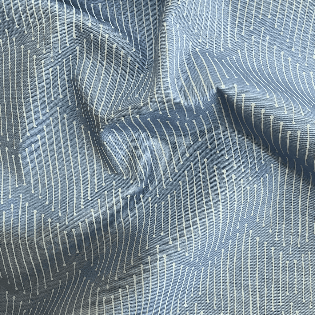 100% cotton quilting fabric — broken white lines on soft grey-blue. 43/44in width.