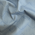 100% cotton quilting fabric — broken white lines on soft grey-blue. 43/44in width.