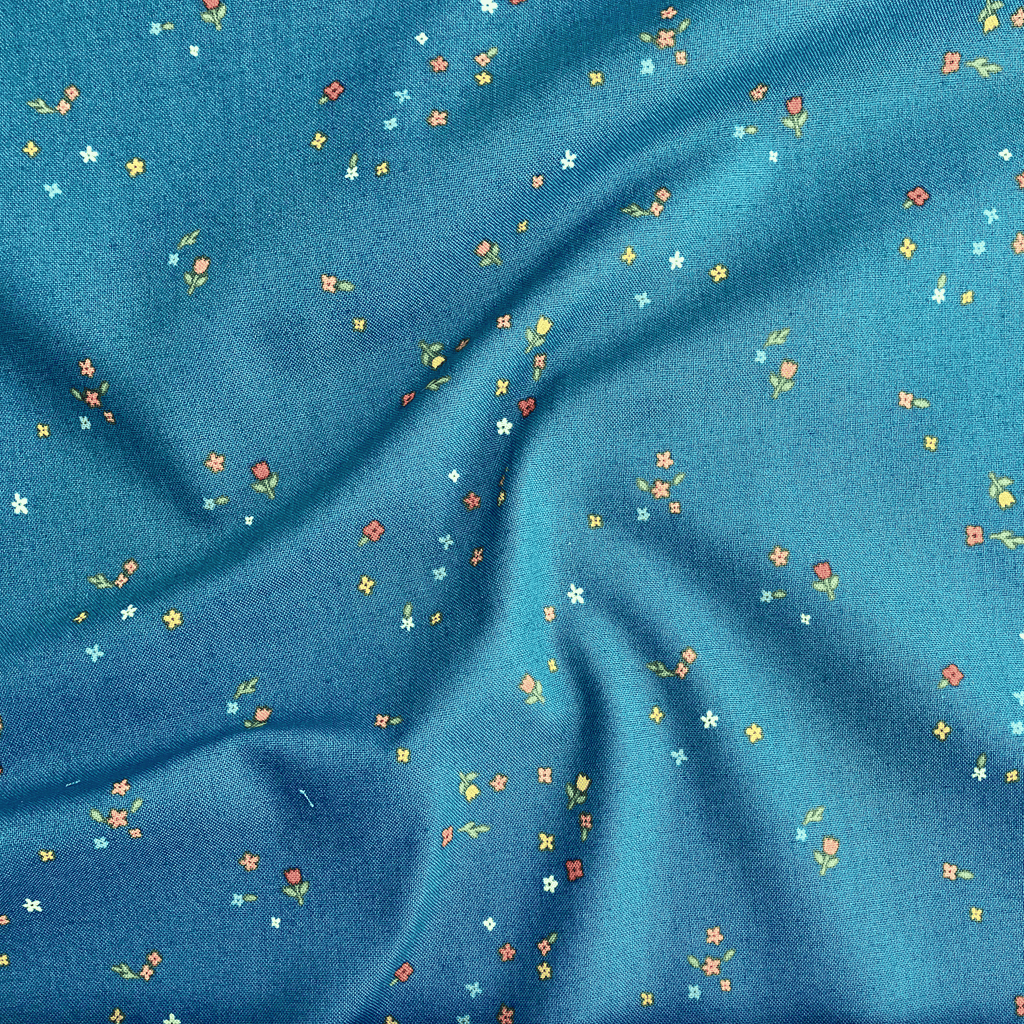 100% cotton quilting fabric — colourful tiny blooms on deep teal. 43/44in width.