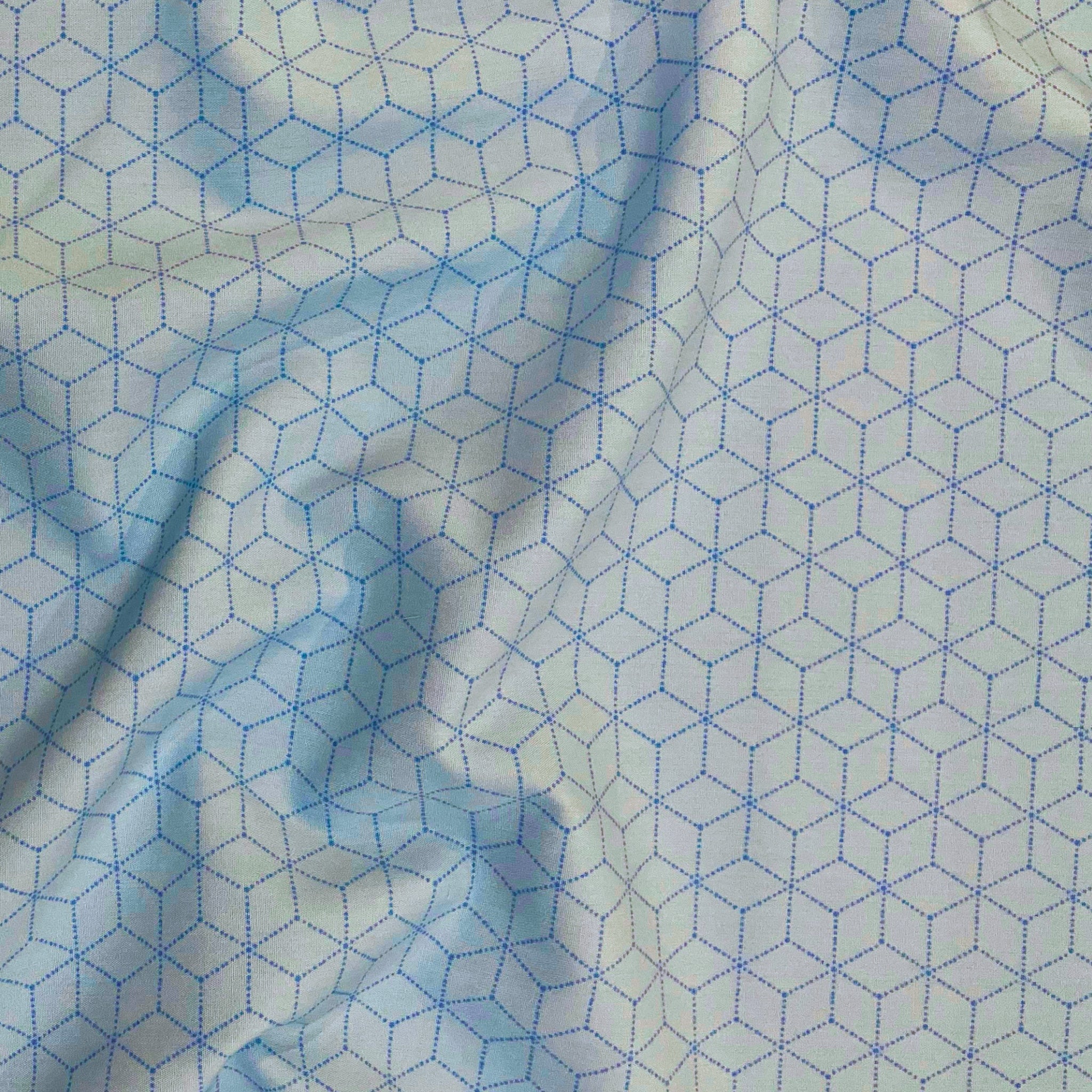 Morning Frost quilting cotton — allover isometric cube lattice in dotted periwinkle blue on a soft icy white background. Art Gallery Fabrics, 44/45″ wide.
