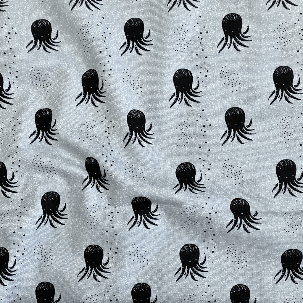100% cotton quilting fabric — black & white octopus on pale blue-grey. 43/44in width.