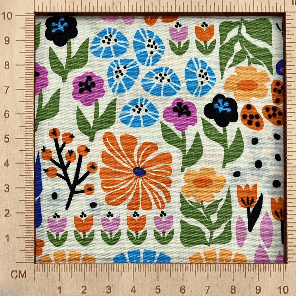 4"x4" scale — 100% cotton quilting fabric — bright multicolour florals on cream. 43/44in width.