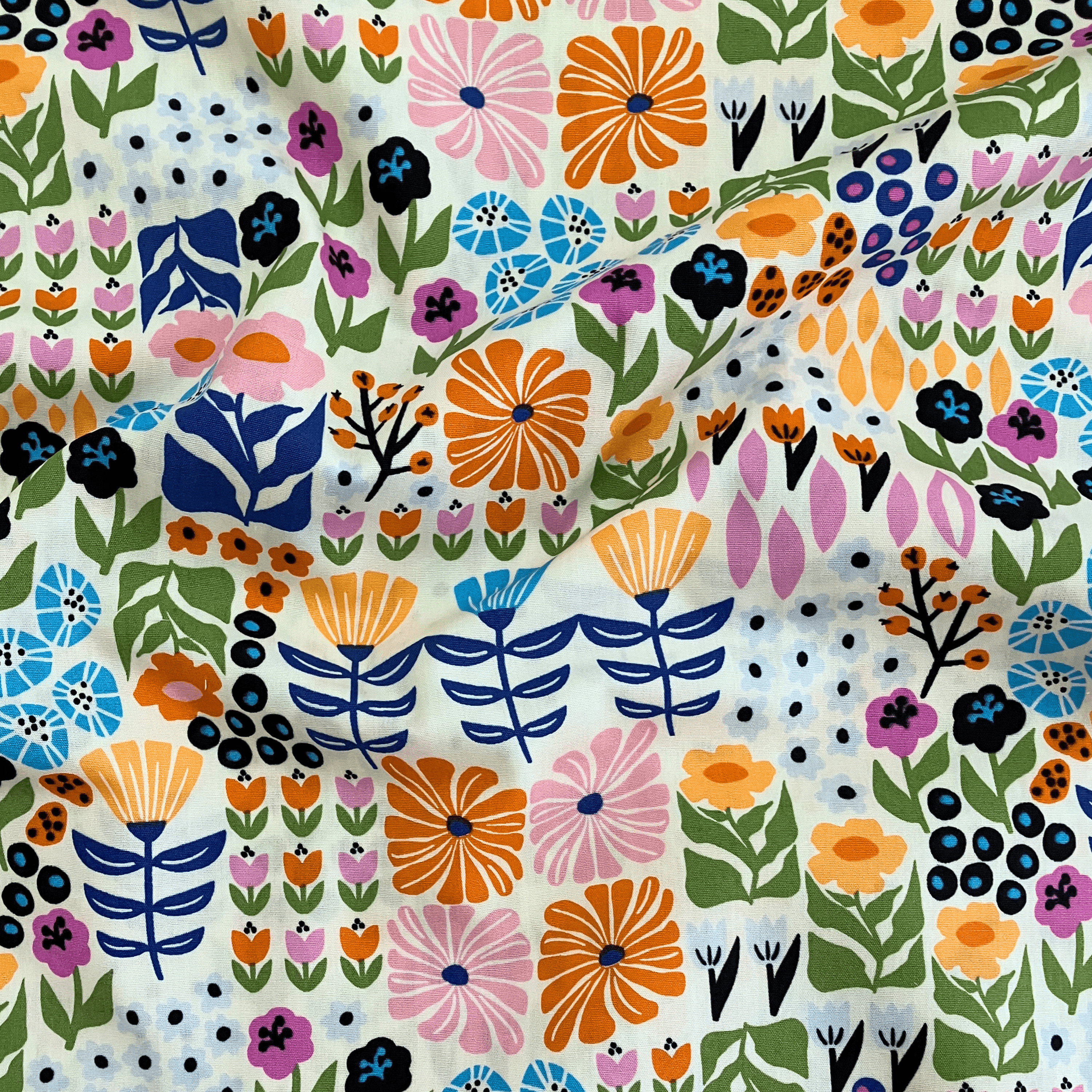 100% cotton quilting fabric — bright multicolour florals on cream. 43/44in width.