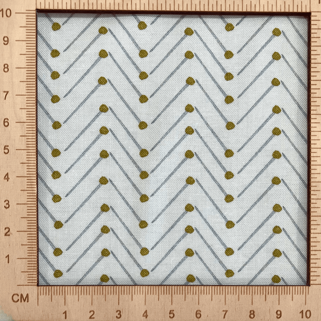 4"x4" scale — 100% cotton quilting fabric — grey & gold pins in chevron pattern on white. 44in width.