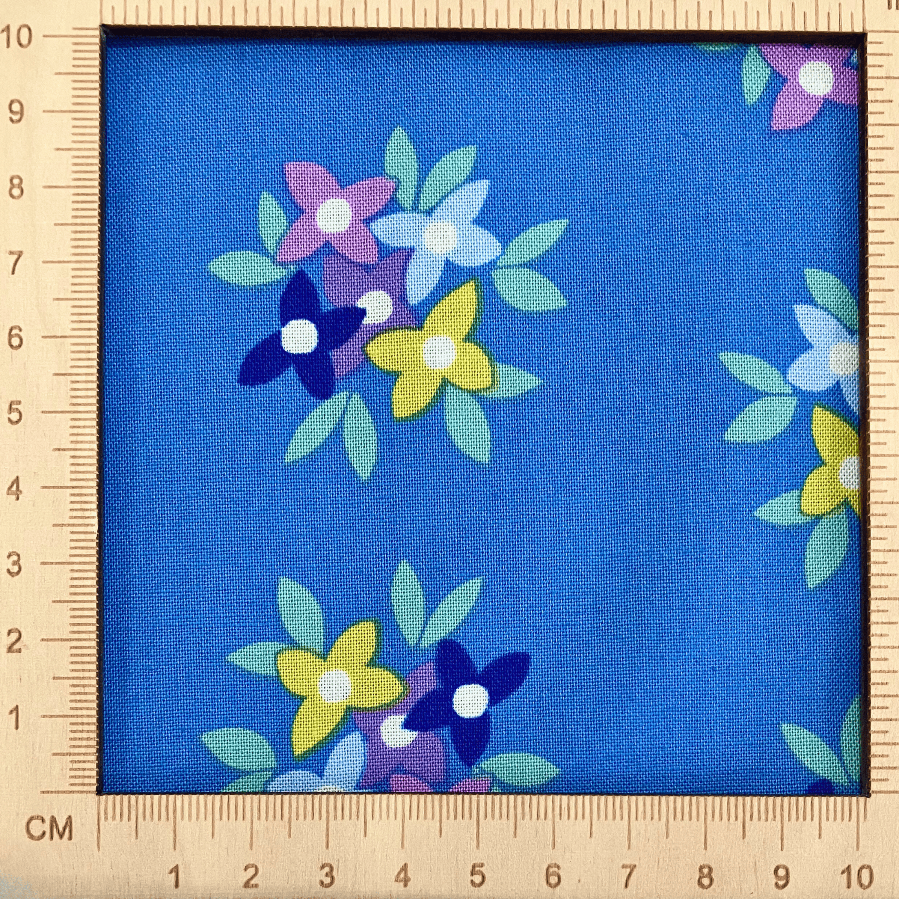 4"x4" scale — 100% cotton quilting fabric — bold floral pattern on blue. 44/45in width.