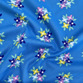 100% cotton quilting fabric — bold floral pattern on blue. 44/45in width.