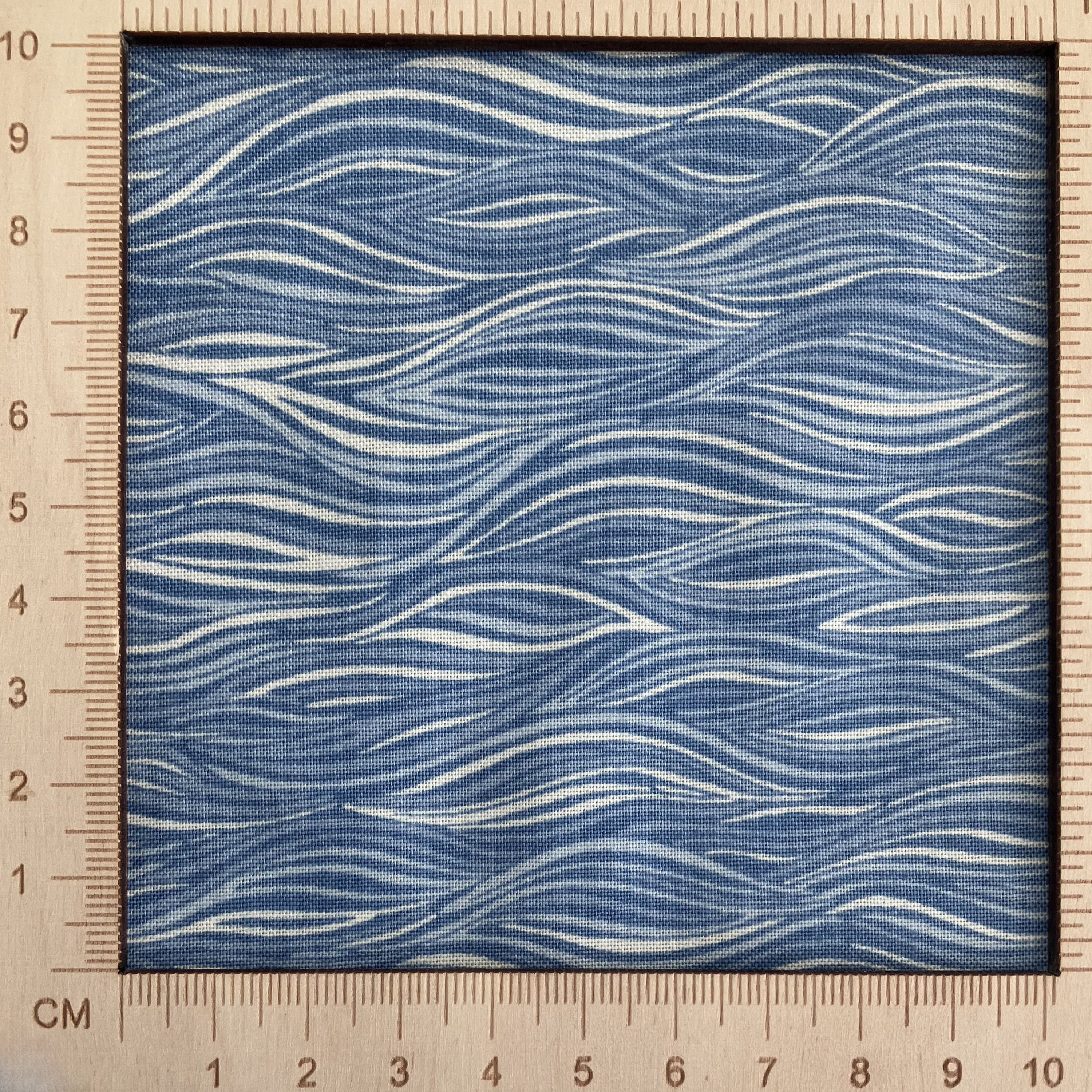 4"x4" scale — 100% cotton quilting fabric — blue wavy ripple pattern. 44/45in width.