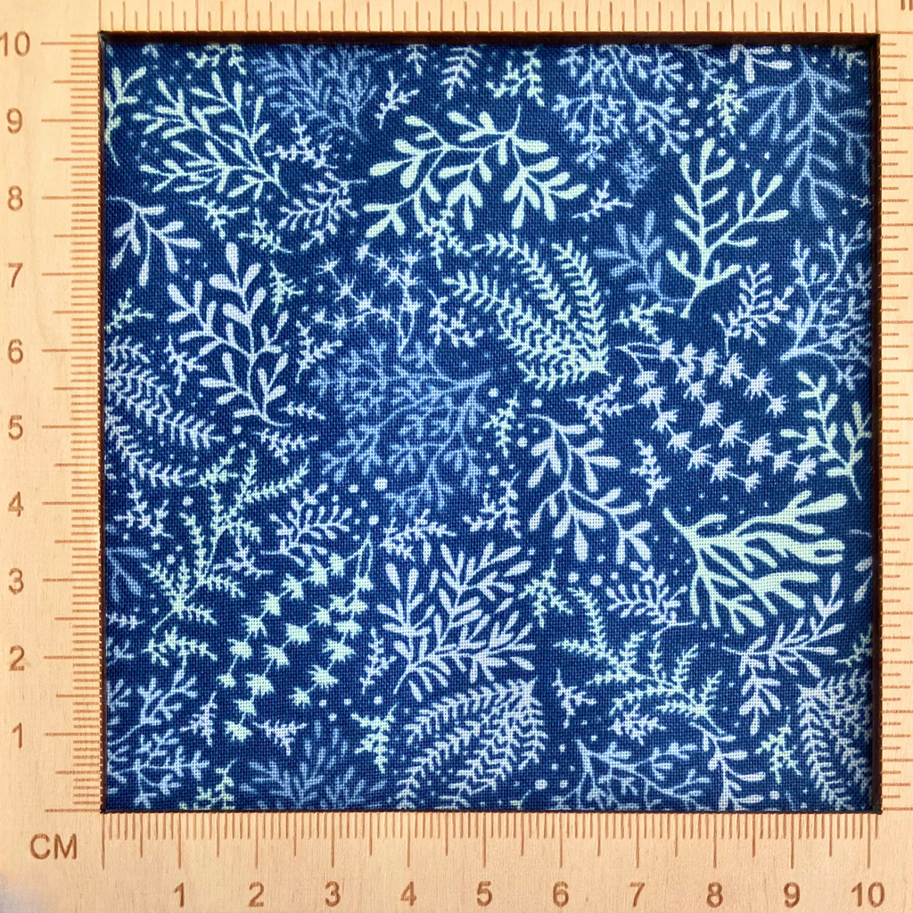 4"x4" scale — 100% cotton quilting fabric — white & pale green seaweed pattern on blue. 44/45in width.