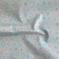 Liberty Fabrics Lasenby cotton — Light pink and green geometric snowflake pattern on mint. Festive Greetings collection. 44/45in width.