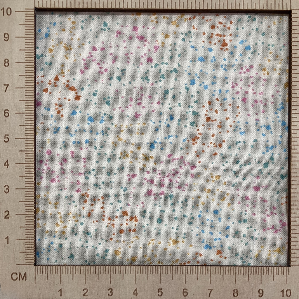 4"x4" scale — 100% cotton quilting fabric — multicolour speckles on cream. 44/45in width.