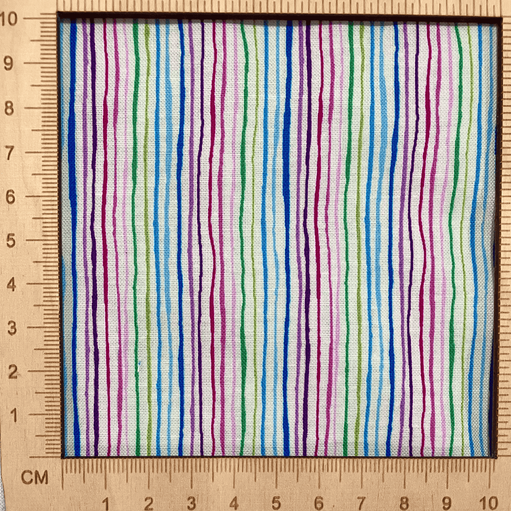 4"x4" scale — 100% cotton quilting fabric — multicoloured stripes on white. 43/44in width.