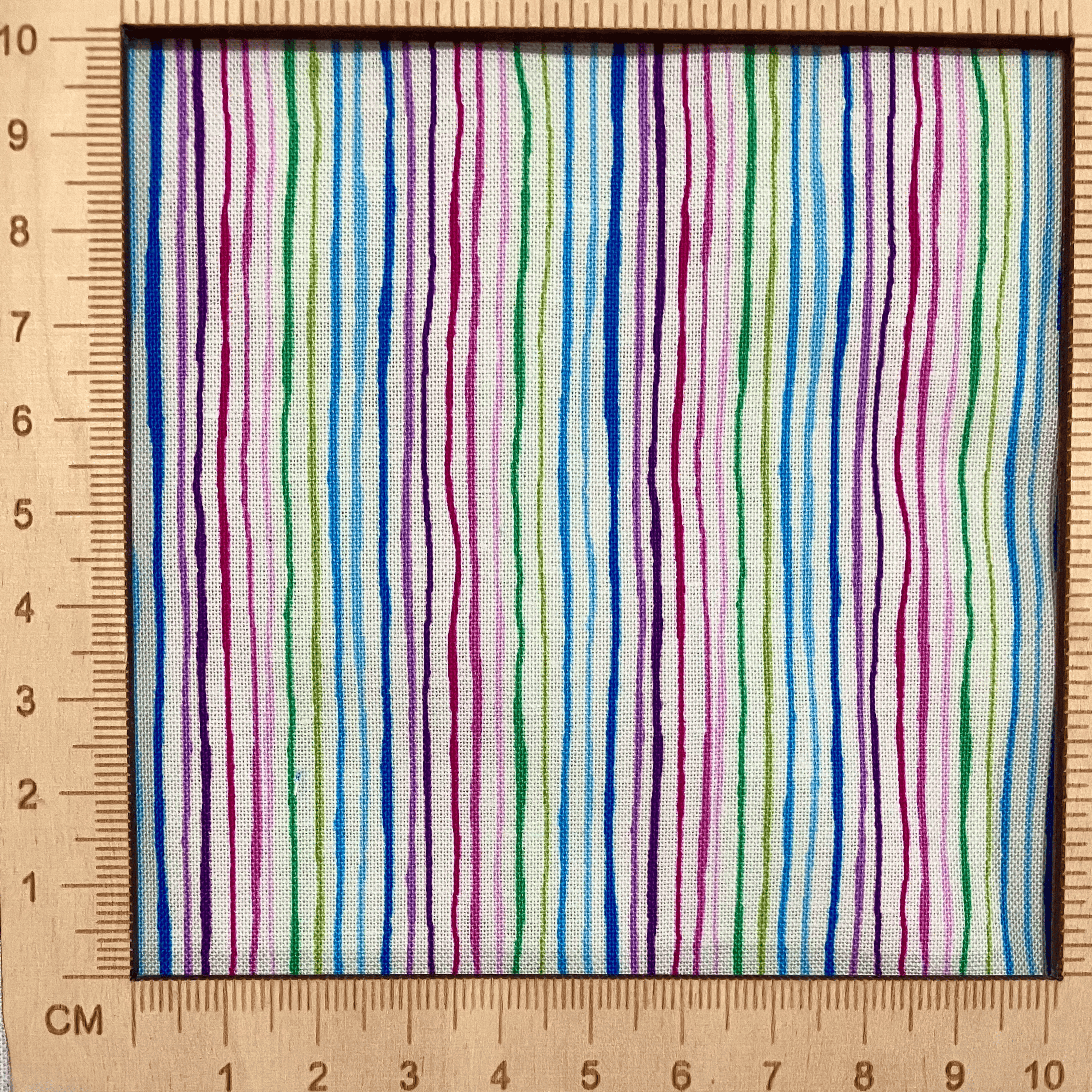 4"x4" scale — 100% cotton quilting fabric — multicoloured stripes on white. 43/44in width.