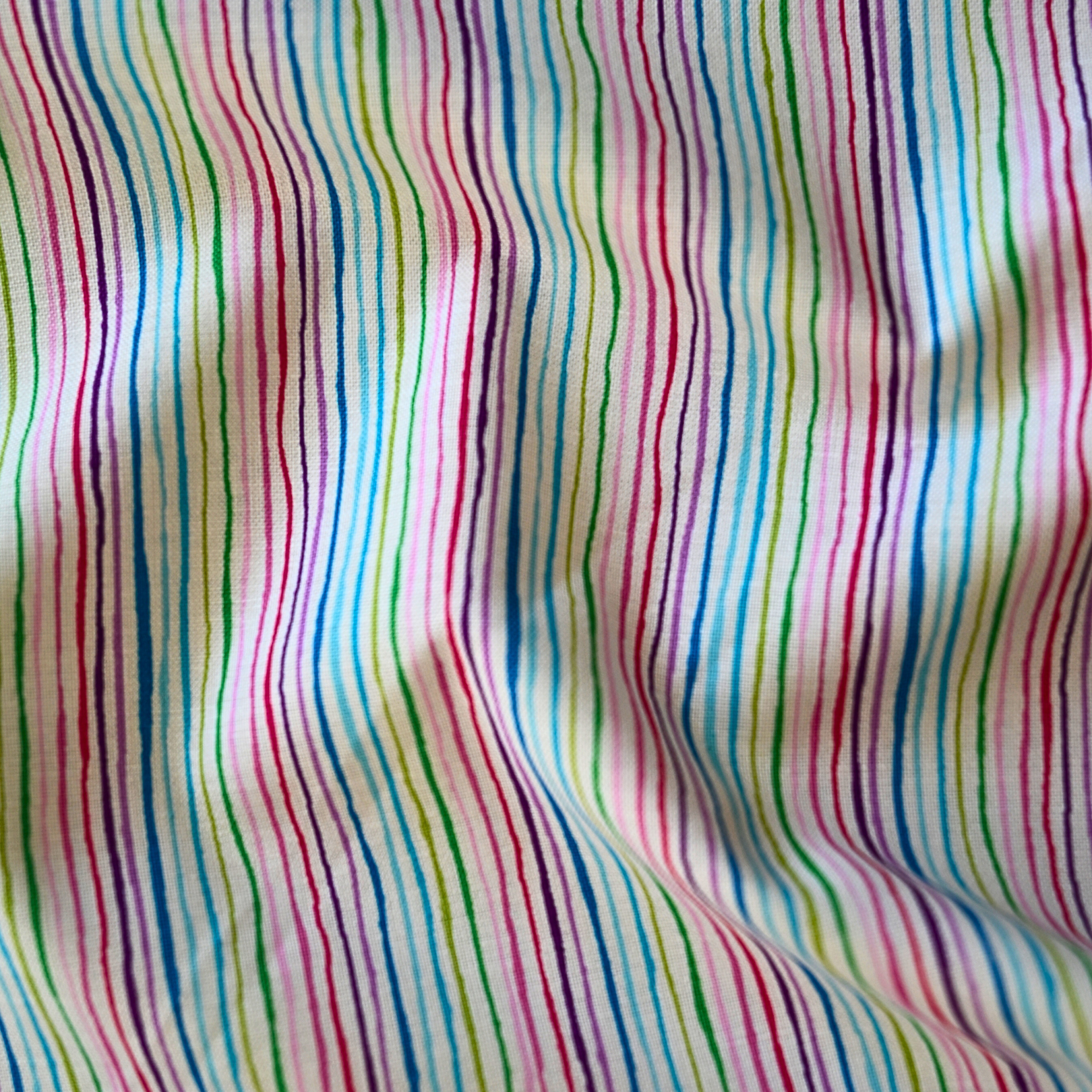 100% cotton quilting fabric — multicoloured stripes on white. 43/44in width.