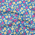 100% cotton quilting fabric — pink, yellow & white flowers on blue. 44/45in width.