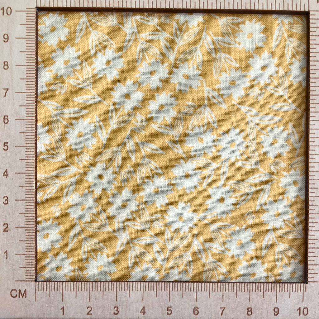 4"x4" scale — 100% cotton quilting fabric — white florals on yellow. 44/45in width.