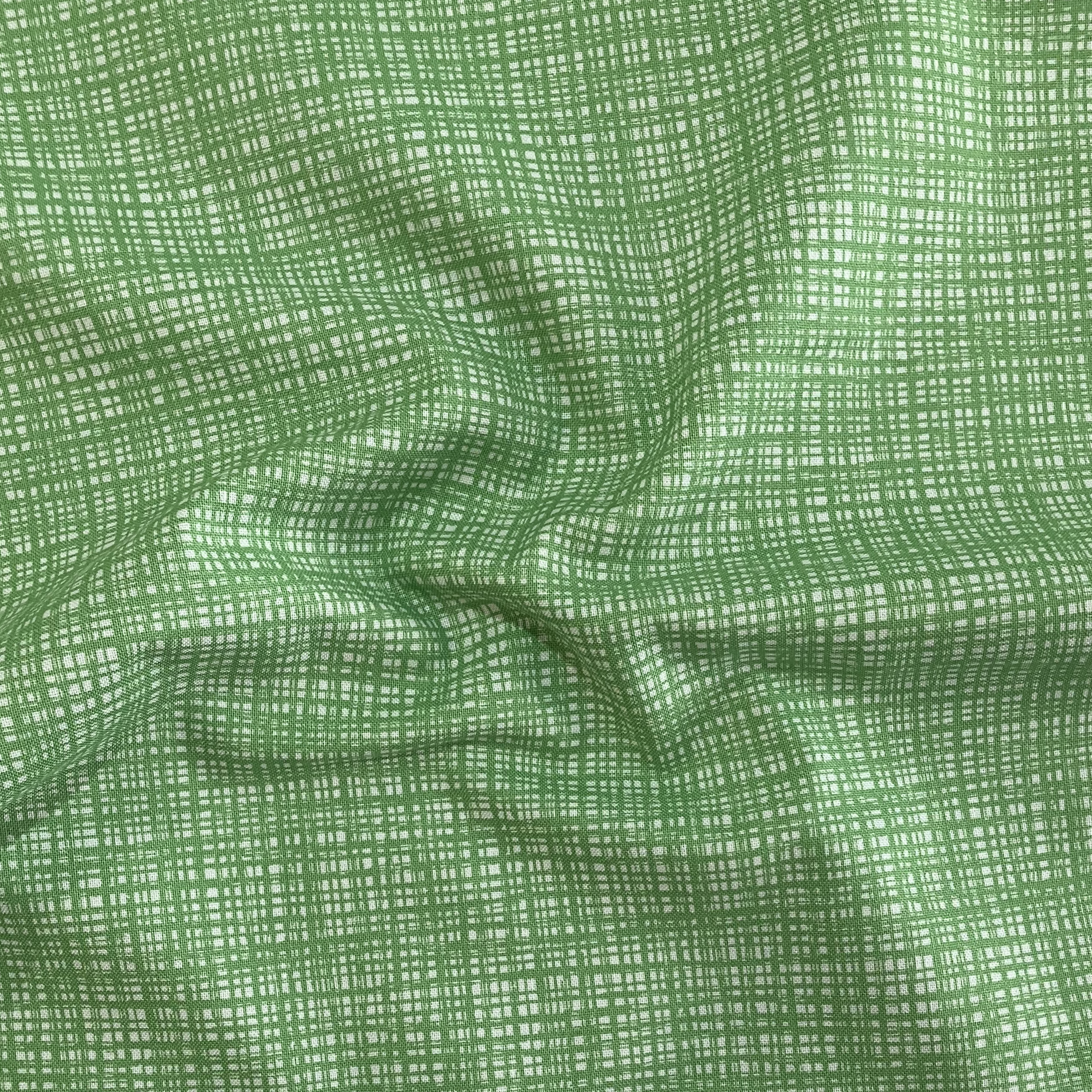 100% cotton quilting fabric — Intersecting bright green lines. 43/44in width.