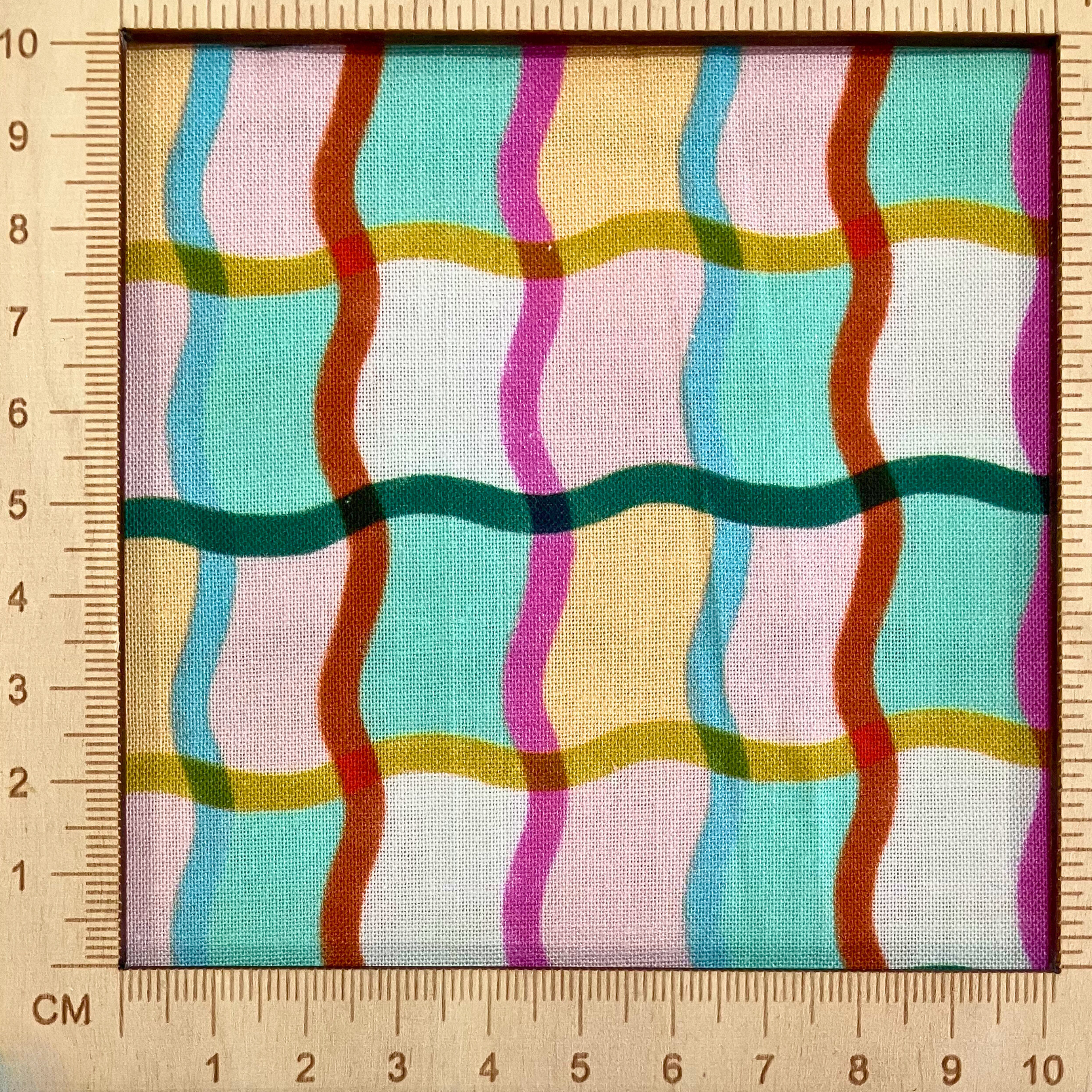4"x4" scale — 100% cotton quilting fabric — multicoloured wavy lines. 44in width.