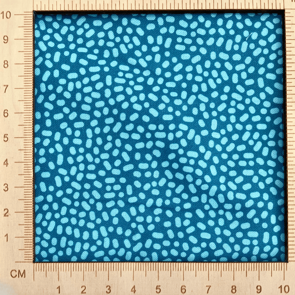 4"x4" scale — 100% cotton quilting fabric — Light green-blue dots on teal. 43/44in width.