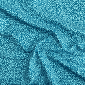100% cotton quilting fabric — Light green-blue dots on teal. 43/44in width.