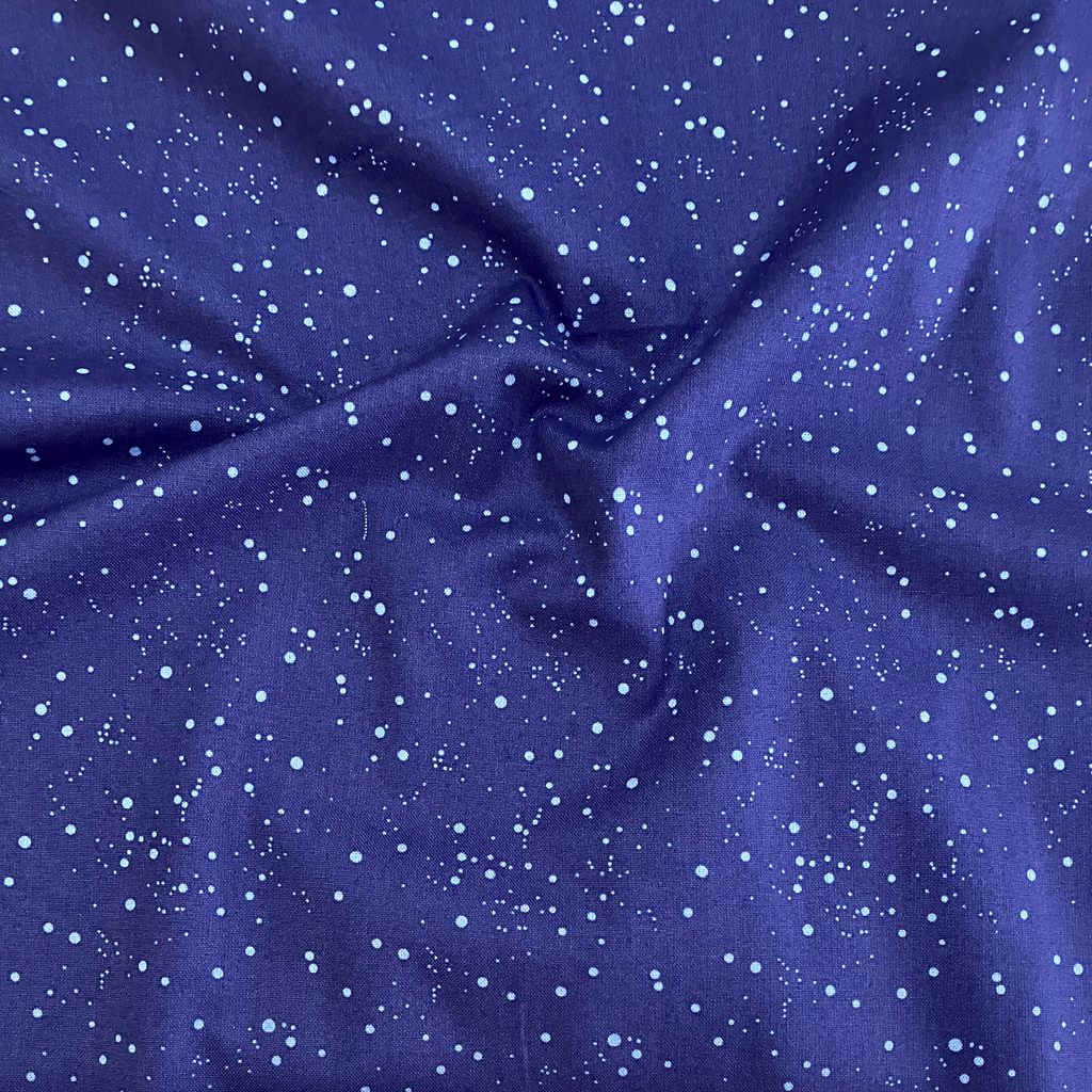 100% cotton quilting fabric — light blue polka dots on indigo navy. 44/45in width.