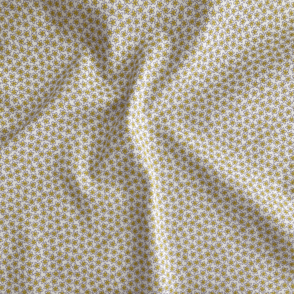 Liberty Fabrics Lasenby cotton — tiny yellow blooms on beige. 44/45in width.