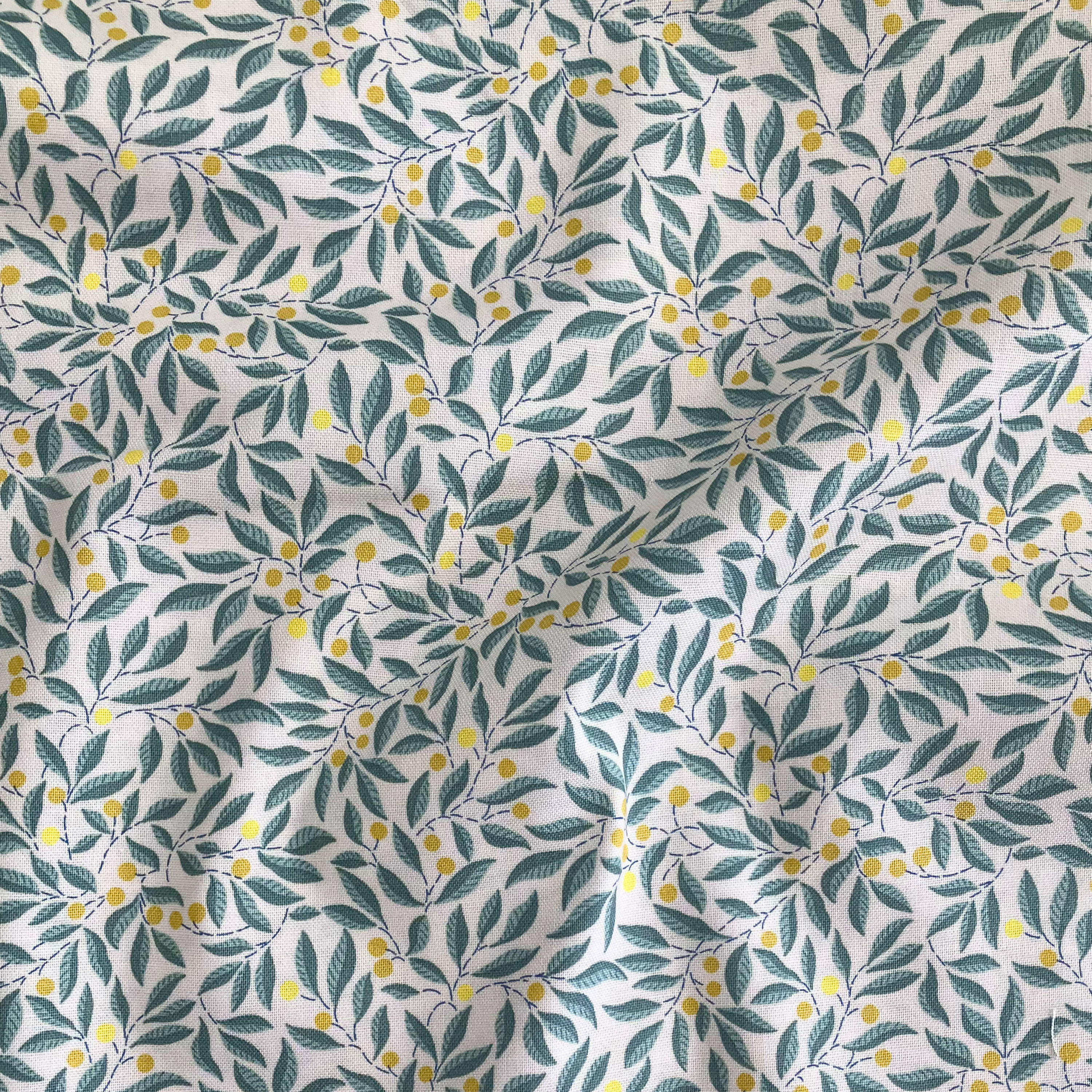 Liberty Fabrics Lasenby cotton — intertwining leafy grey-green branches with yellow berries. 44/45in width.