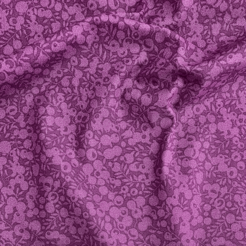 Liberty Fabrics Lasenby cotton — subtle tonal floral shadow pattern on deep purple. 44/45in width.