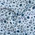 100% cotton quilting fabric — grey deer, owls, mushrooms & trees on light grey-blue. 44/45in width.